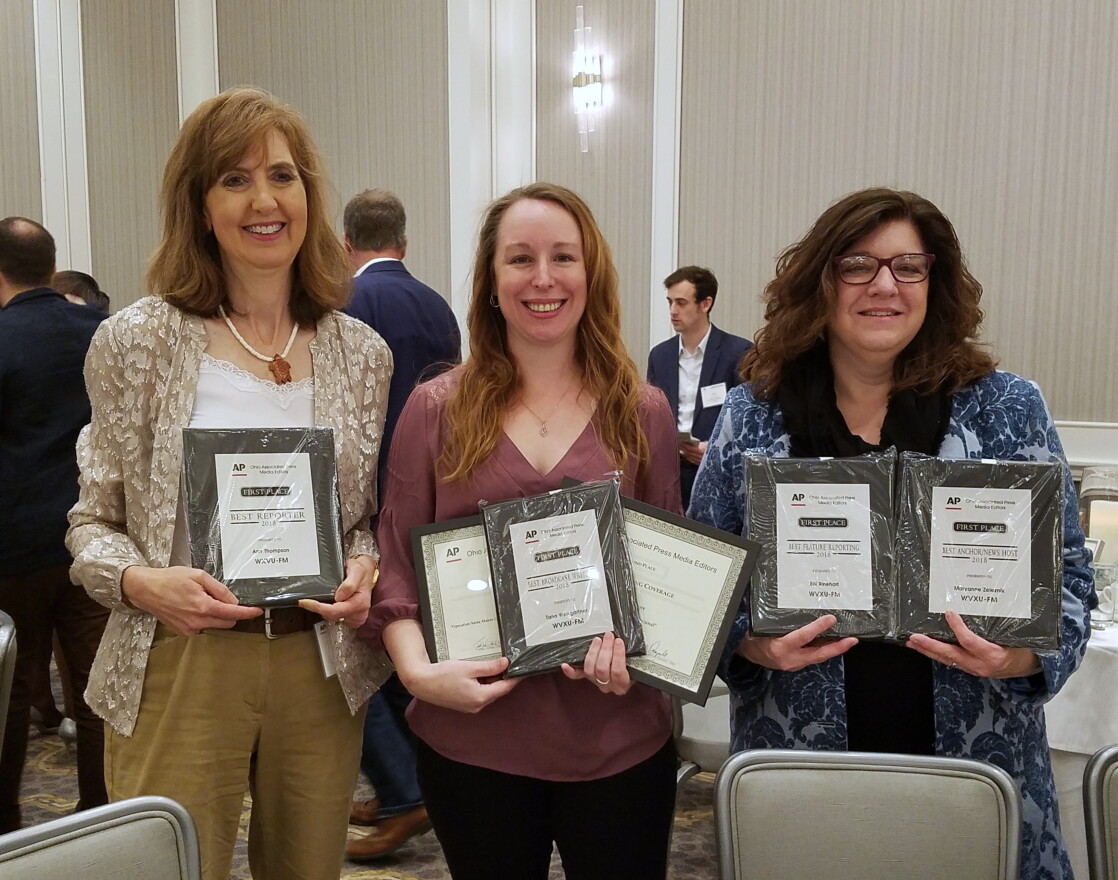 Reporters (from left) Ann Thompson and Tana Weingartner with News Director Maryanne Zeleznik and their awards. 